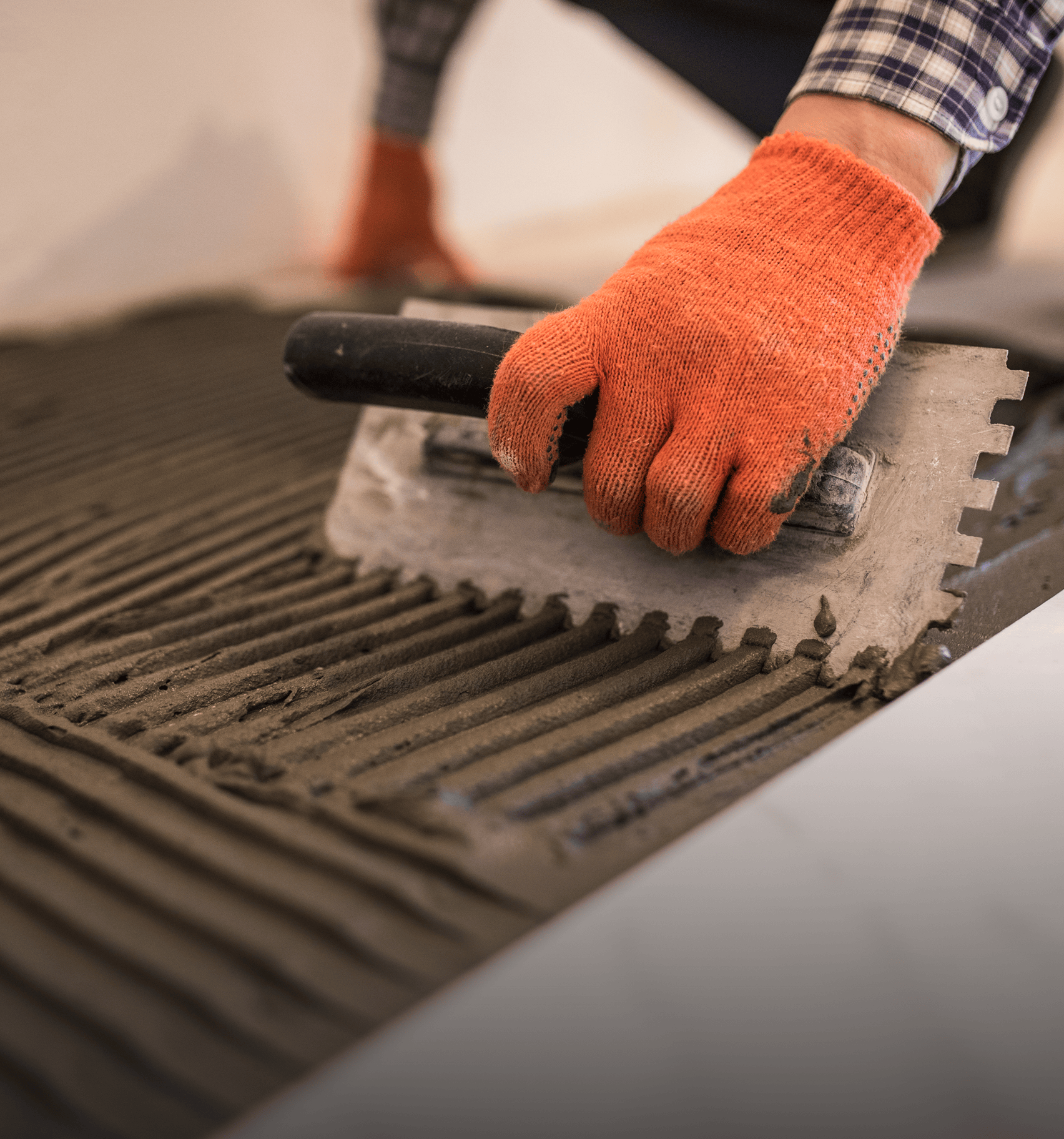 Worker installing tiles